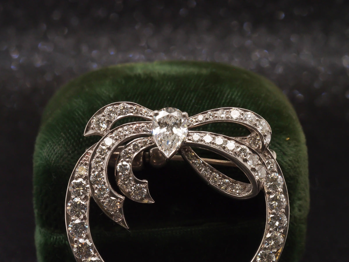 Platinum 1940s GIA Pear Shape & Round Diamond Ribbon Brooch