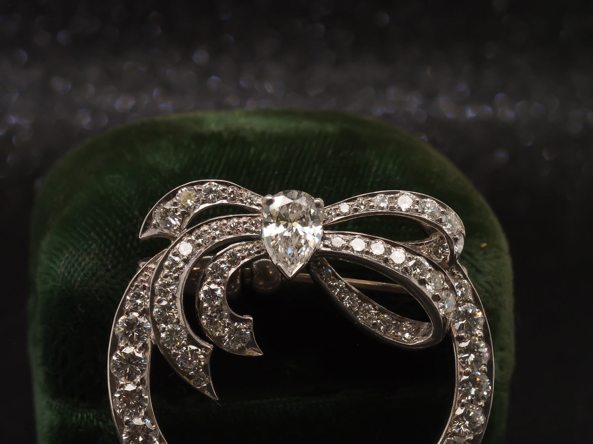 Platinum 1940s GIA Pear Shape & Round Diamond Ribbon Brooch