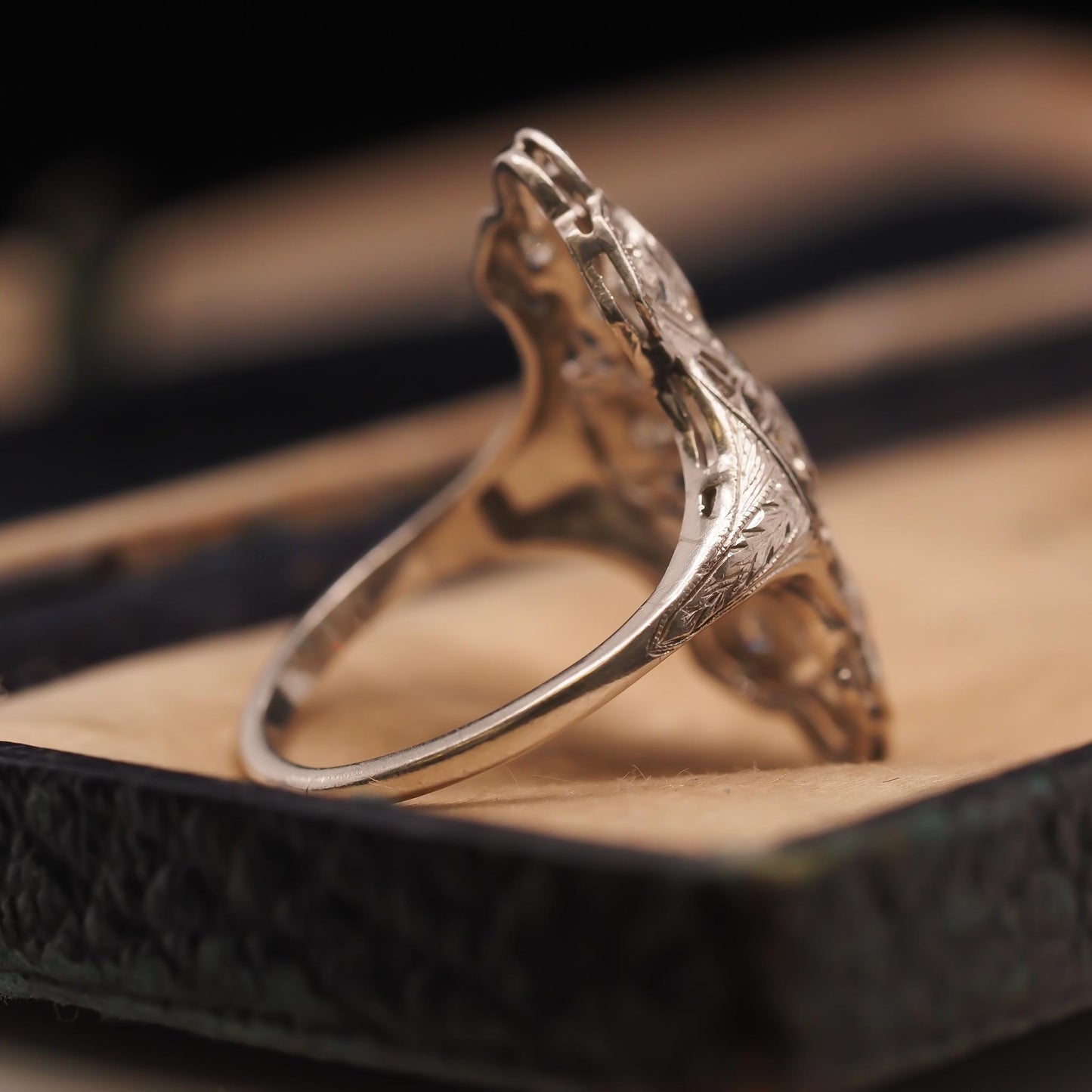 Circa 1920s Platinum Shield Ring with Old European Cut Diamond and Emeralds