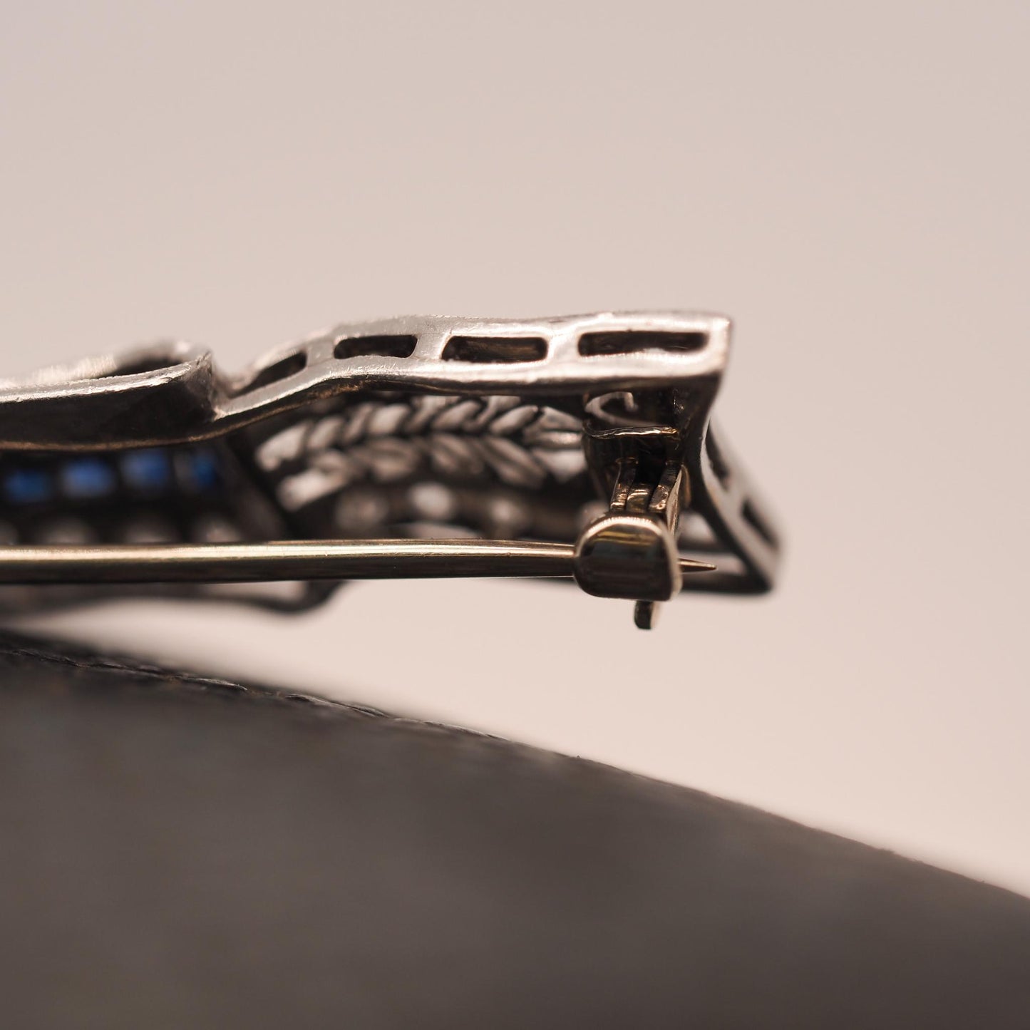 Circa 1920s Art Deco Platinum Sapphire and Diamond Ribbon Brooch