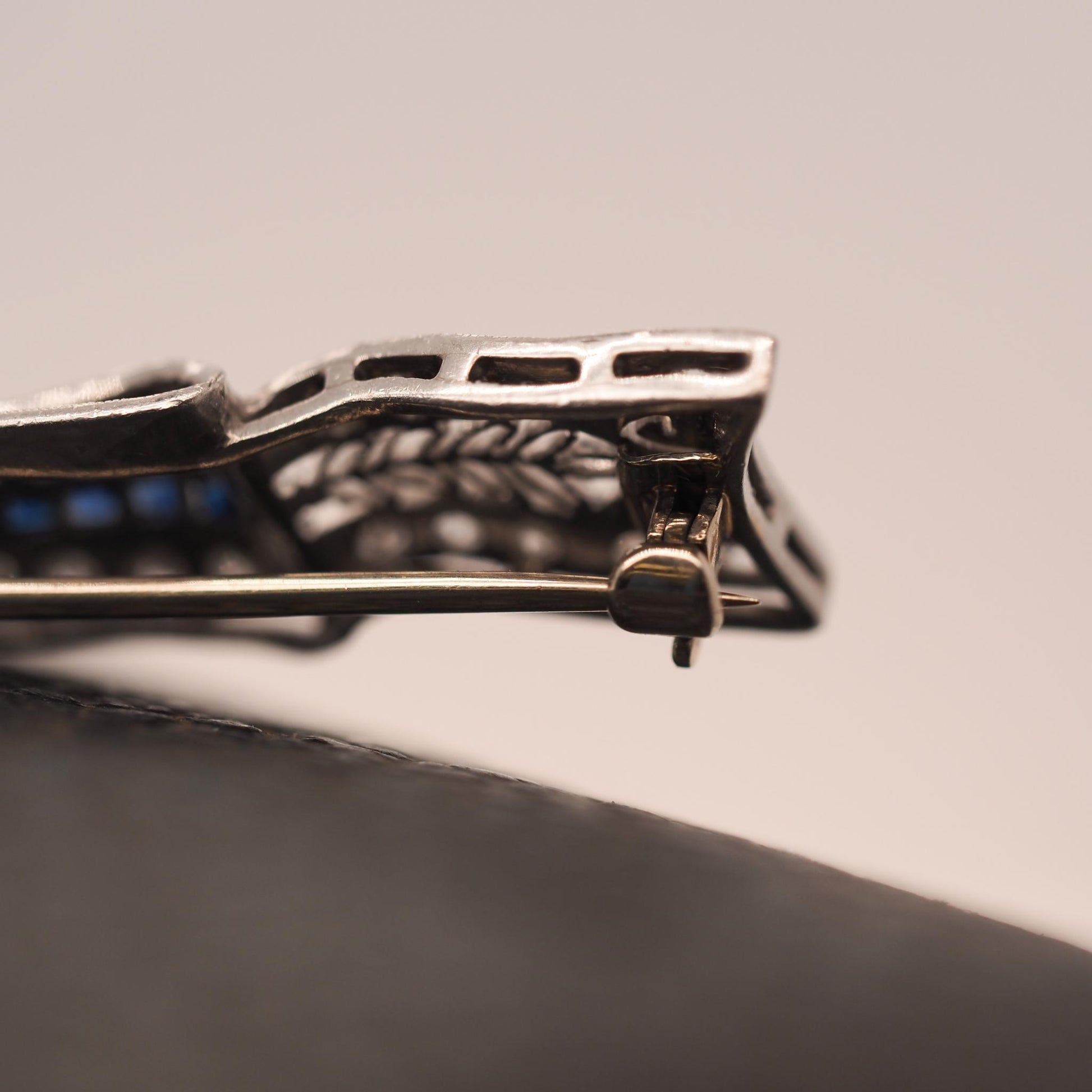 Circa 1920s Art Deco Platinum Sapphire and Diamond Ribbon Brooch