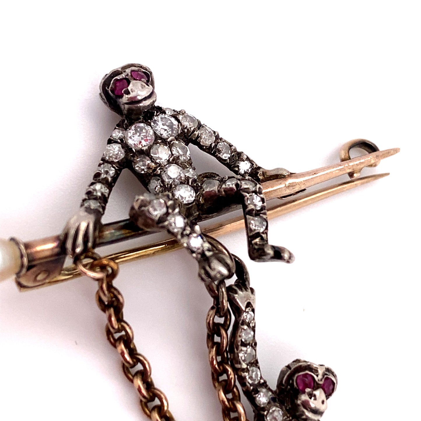 Circa 1890 Victorian Diamond and Ruby Twin Monkeys Brooch in Platinum and Gold