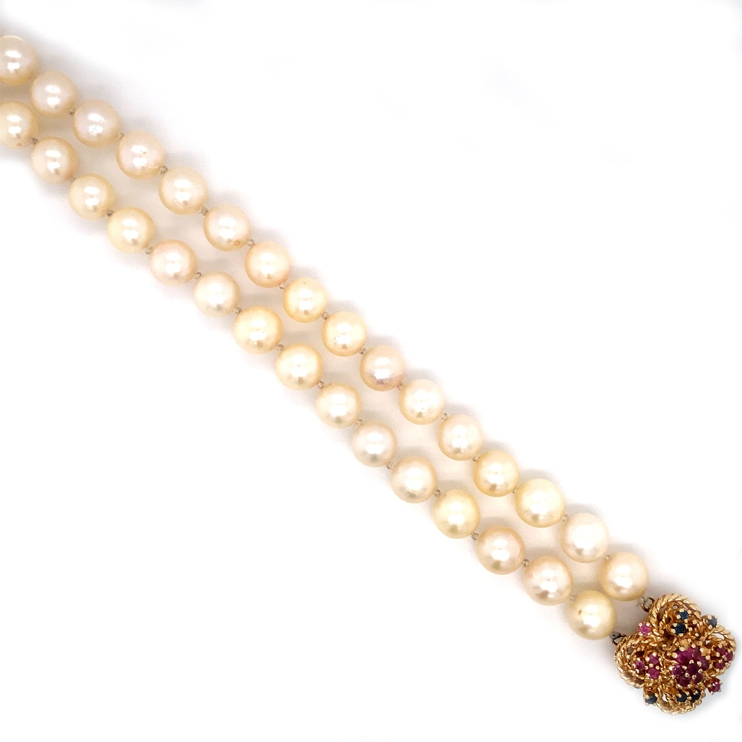 Circa 1980 Double Strand Pearl Bracelet with Ruby and Sapphire Clasp in 14 Karat Gold