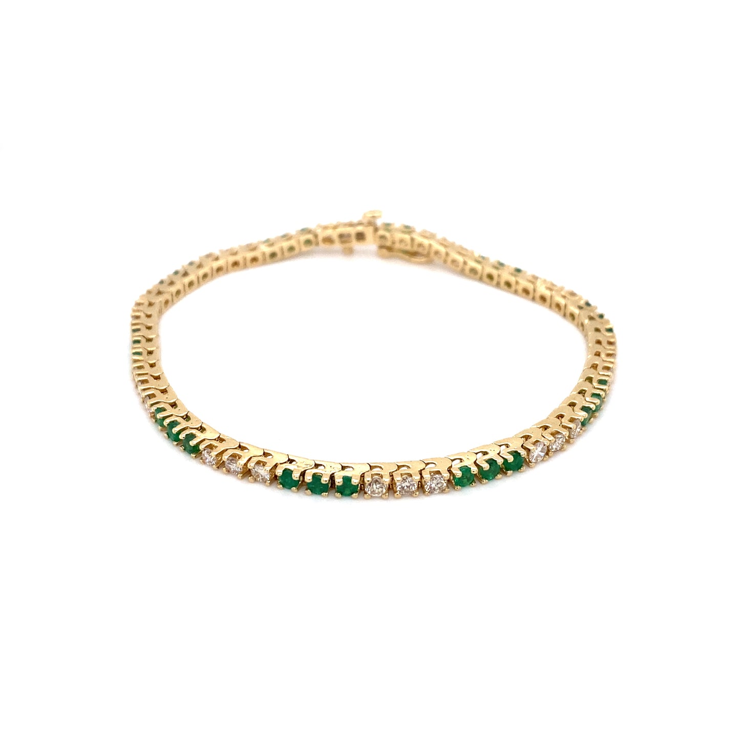 Circa 1980s Alternating Emerald and Diamond Tennis Bracelet in 14K Gold