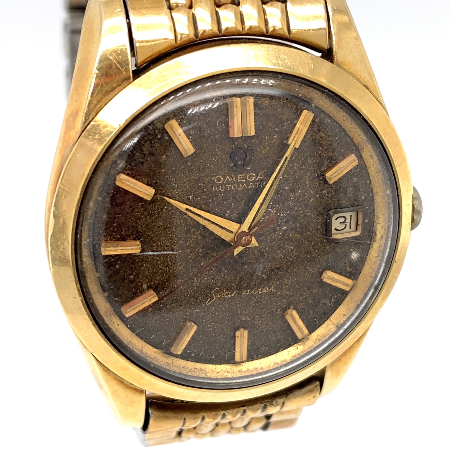 Circa 1960s Omega Seamaster Gold Tone Calendar Wrist Watch with Stardust Dial