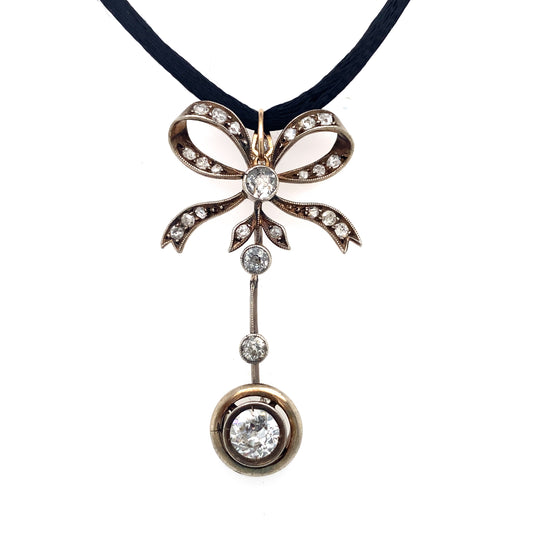 Circa 1890s Victorian Gold and Platinum Diamond Drop Bow Pendant on Silk Cord
