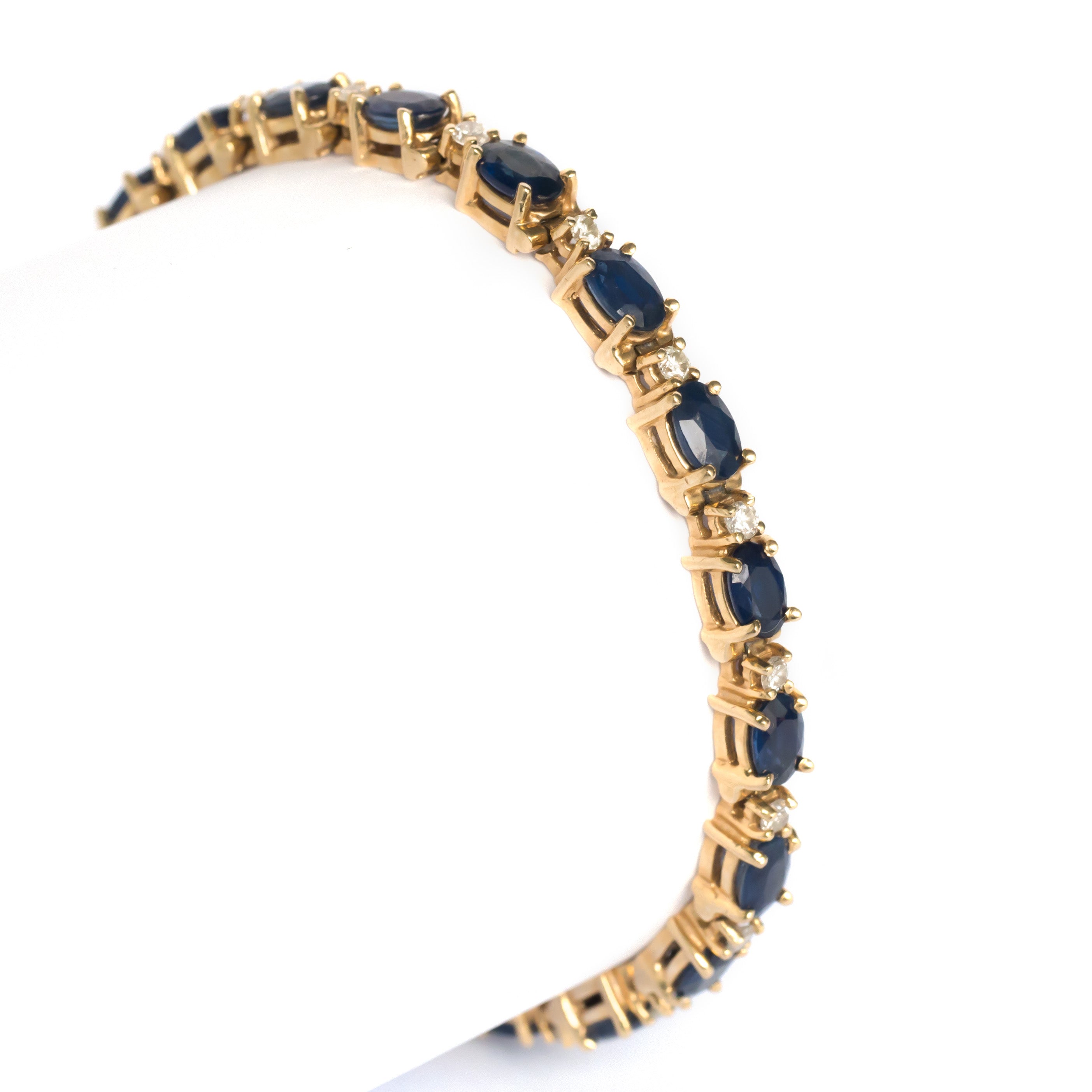 A gold, diamond, and sapphire woven gold bracelet. Supple and yet  structured in all of the right ways and by the master French jeweler…