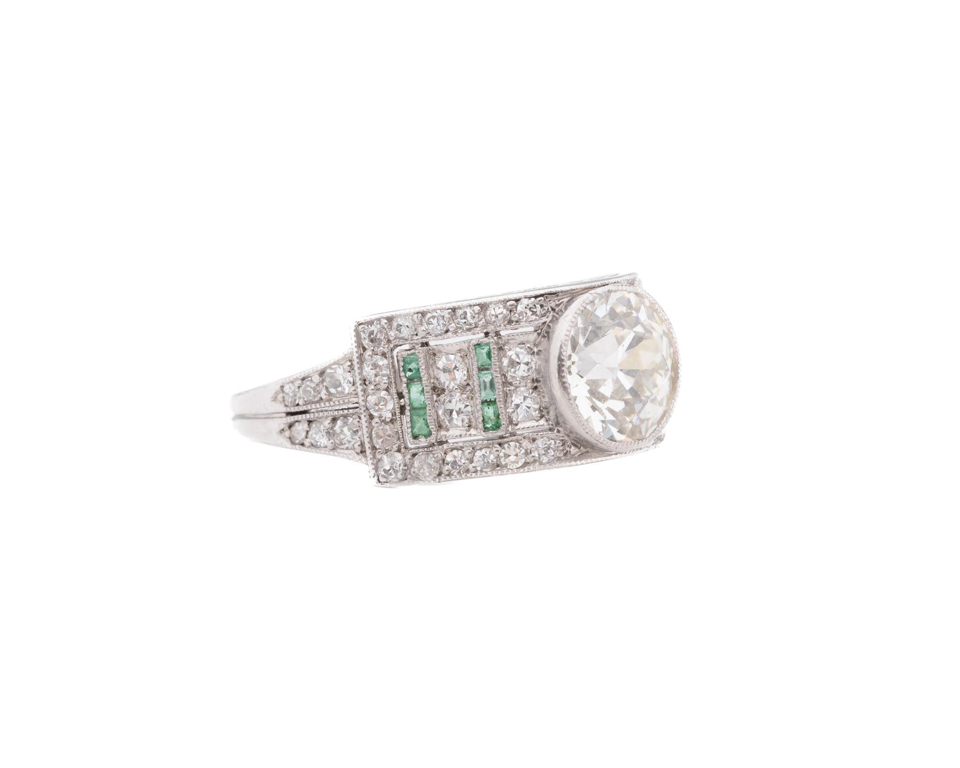 Circa 1920s Art Deco Emerald and Old European Diamond Engagement Ring